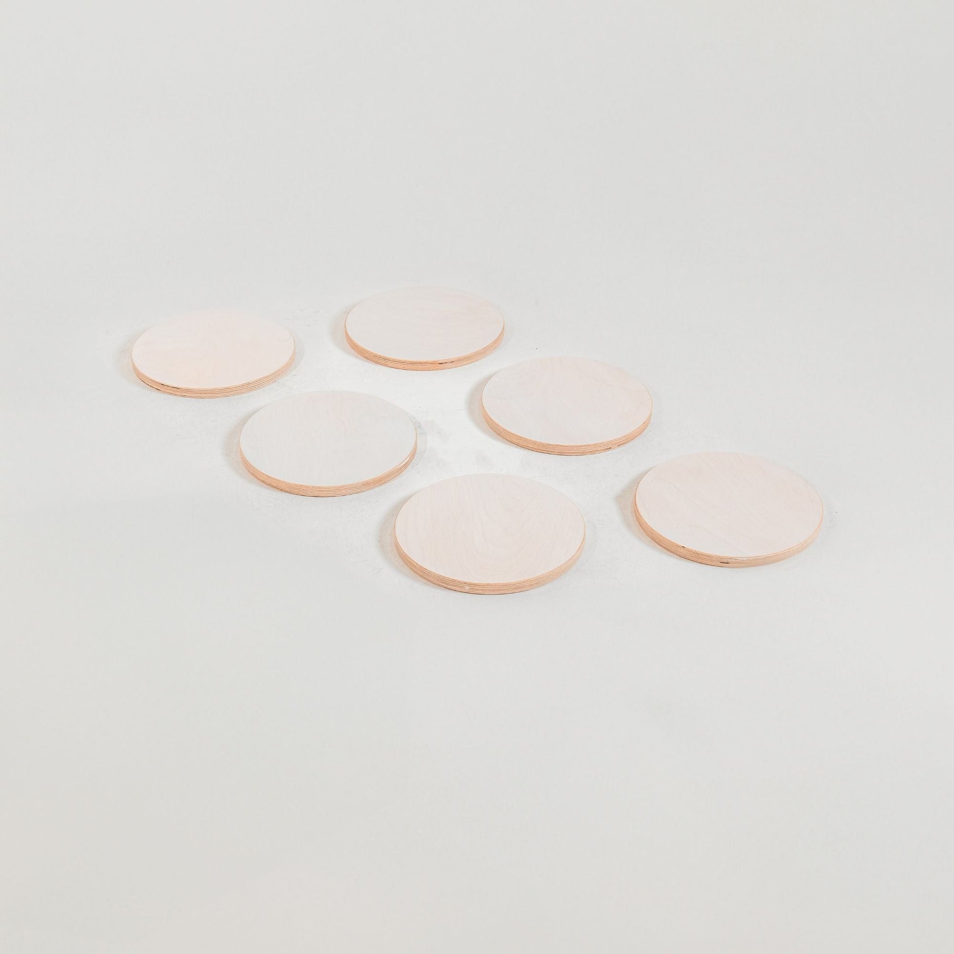 Kids jumping on outdoor stepping stones